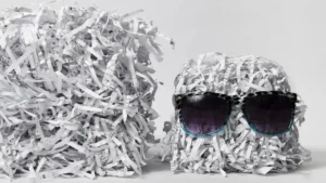 Pile of shredded paper wearing sunglasses after commercial shredding in London